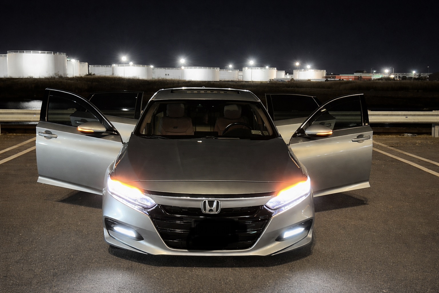 Honda Accord EX-L at night with all four doors open and lights on